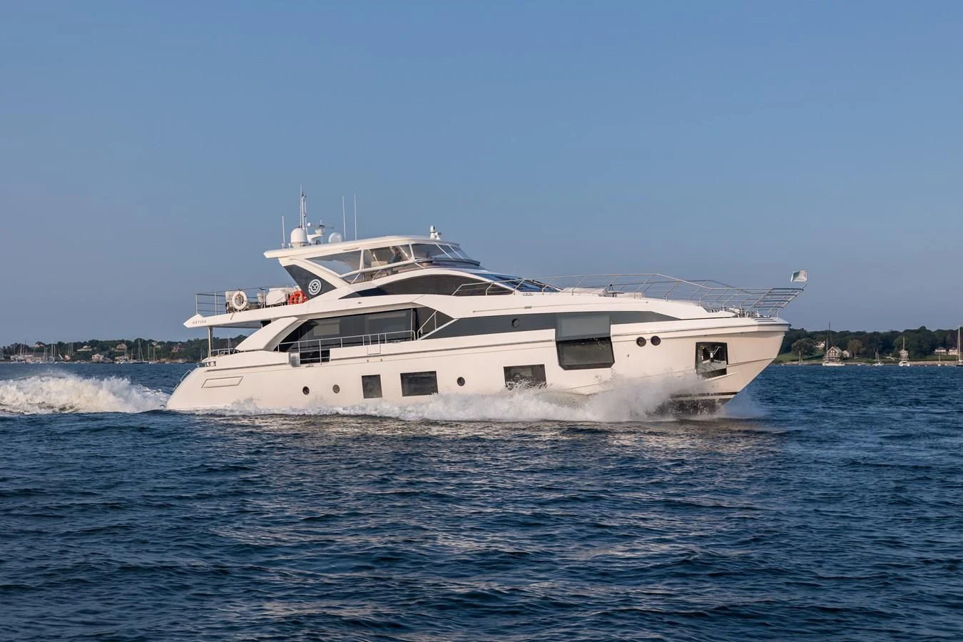 a white yacht on the water aboard CAPTAIN MORGAN II Yacht for Sale