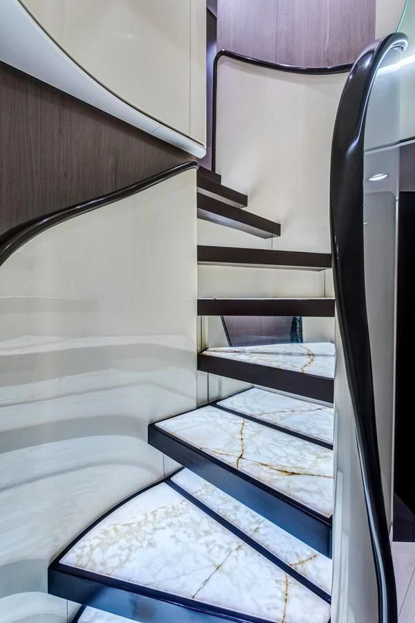 a staircase with a glass window aboard CAPTAIN MORGAN II Yacht for Sale