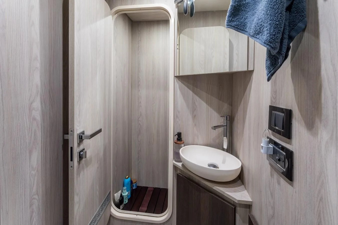 a bathroom with a sink and a mirror aboard CAPTAIN MORGAN II Yacht for Sale