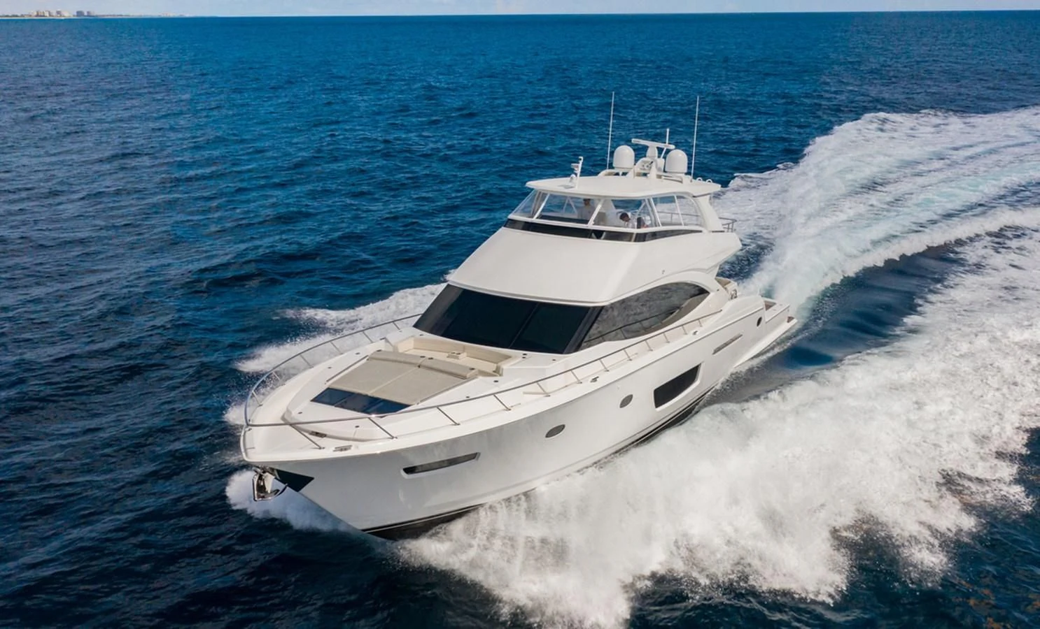 a white yacht on the water aboard NEW VIKING 82 COCKPIT MOTOR YACHT Yacht for Sale