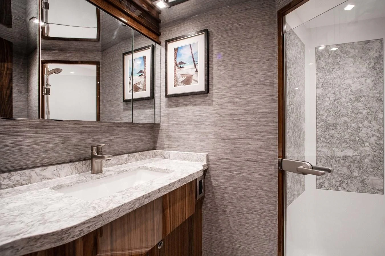 a bathroom with a sink and mirror aboard NEW VIKING 82 COCKPIT MOTOR YACHT Yacht for Sale