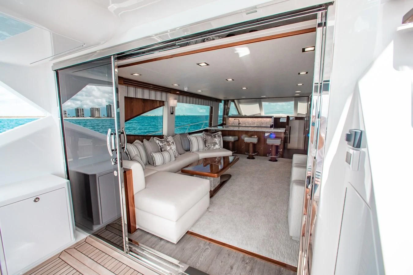 a room with a couch and a table aboard NEW VIKING 82 COCKPIT MOTOR YACHT Yacht for Sale