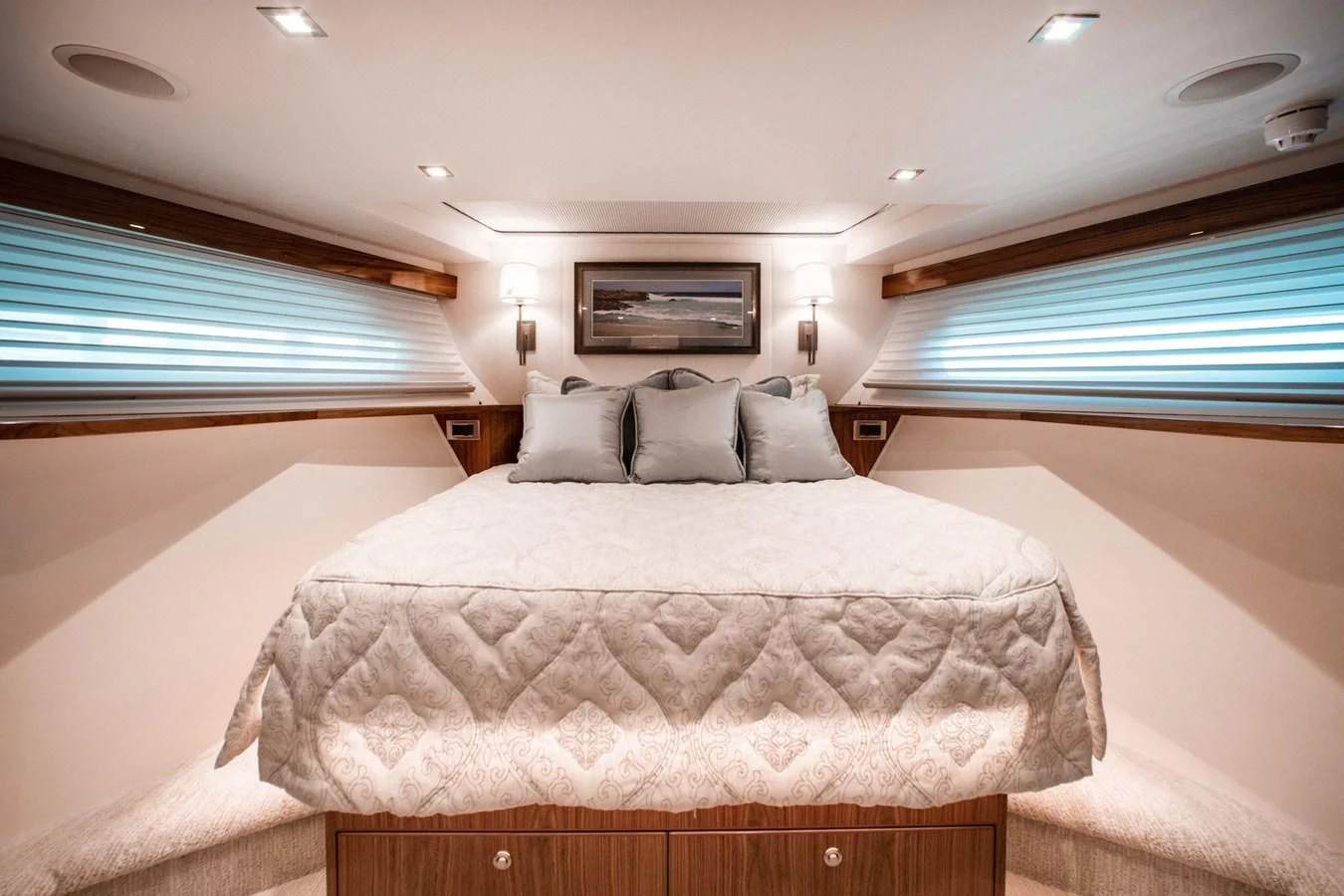 a bedroom with a bed and a window aboard NEW VIKING 82 COCKPIT MOTOR YACHT Yacht for Sale