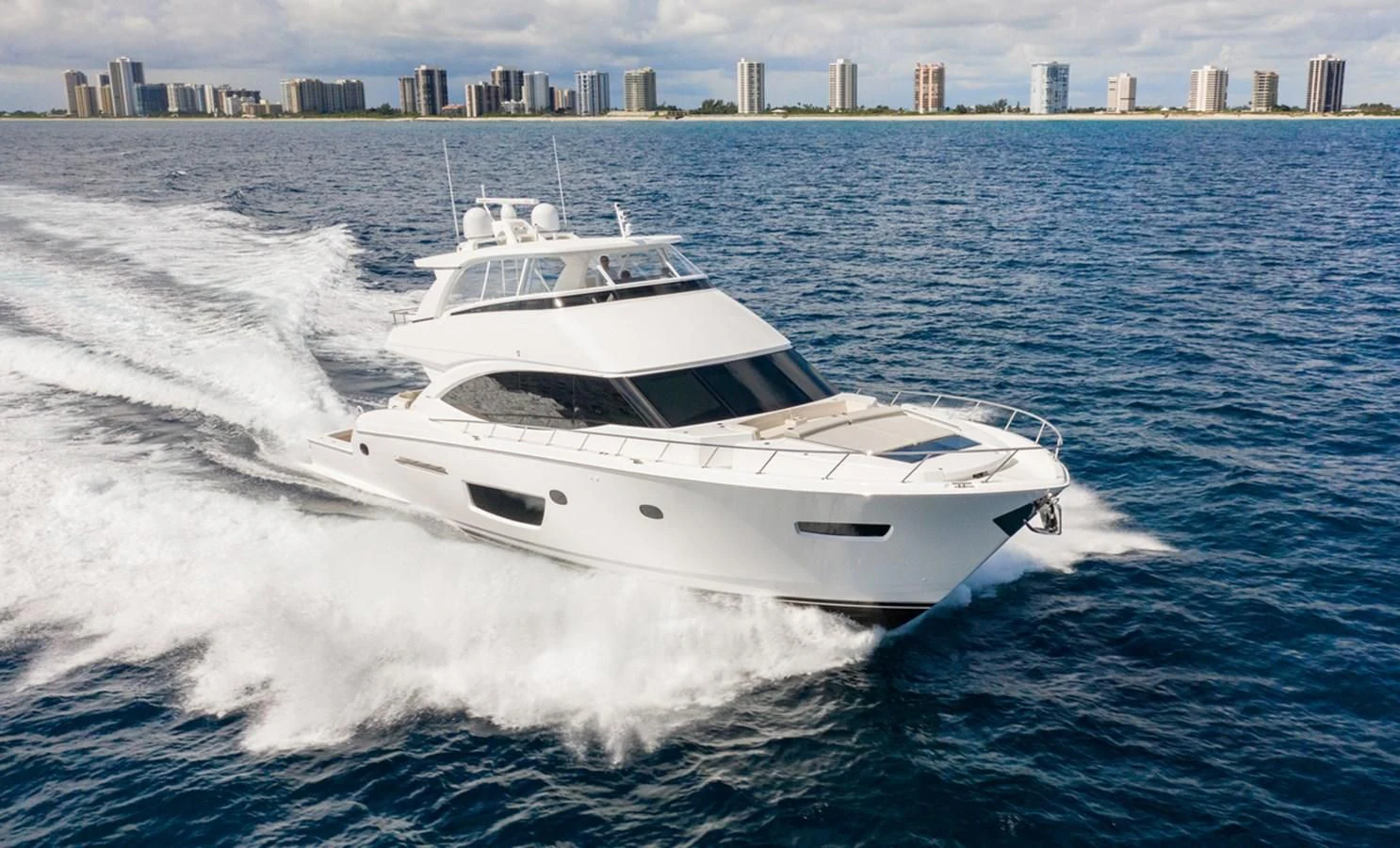 a white yacht on the water aboard NEW VIKING 82 COCKPIT MOTOR YACHT Yacht for Sale