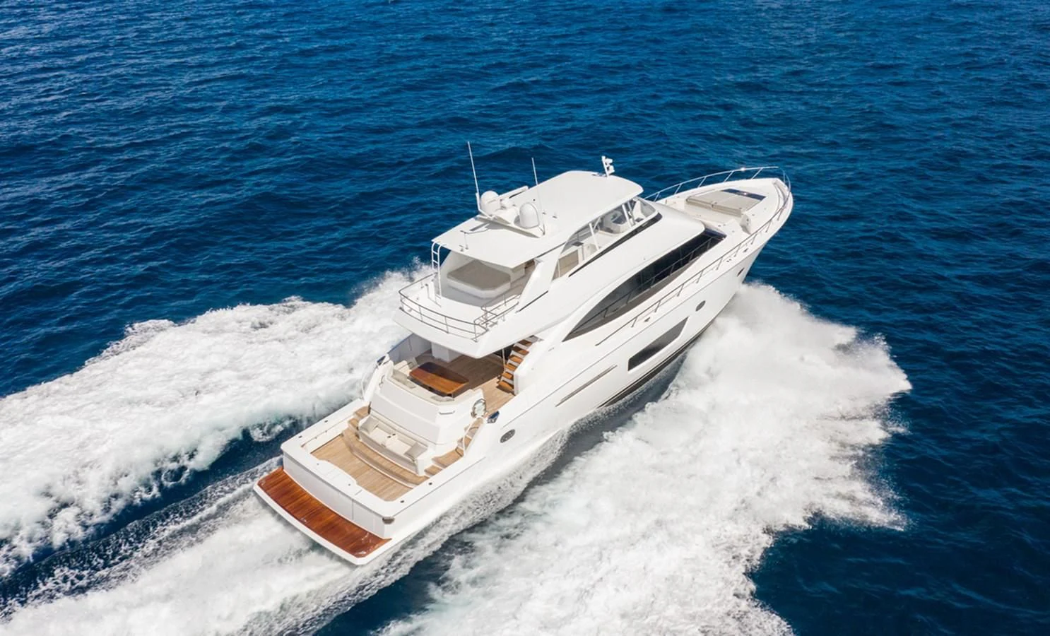 a ship on the water aboard NEW VIKING 82 COCKPIT MOTOR YACHT Yacht for Sale