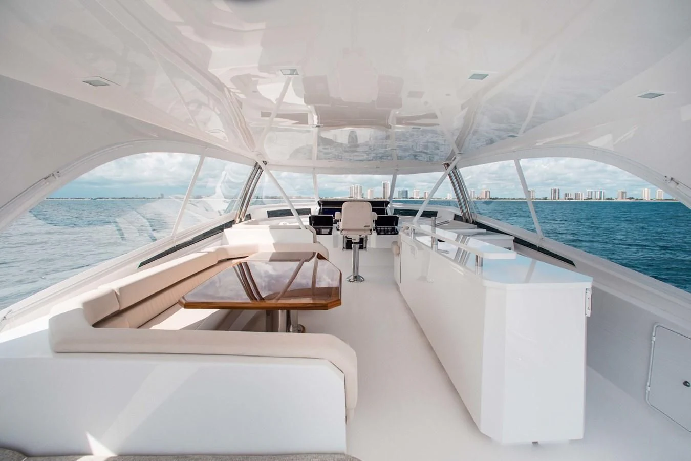 a boat with a large white deck aboard NEW VIKING 82 COCKPIT MOTOR YACHT Yacht for Sale