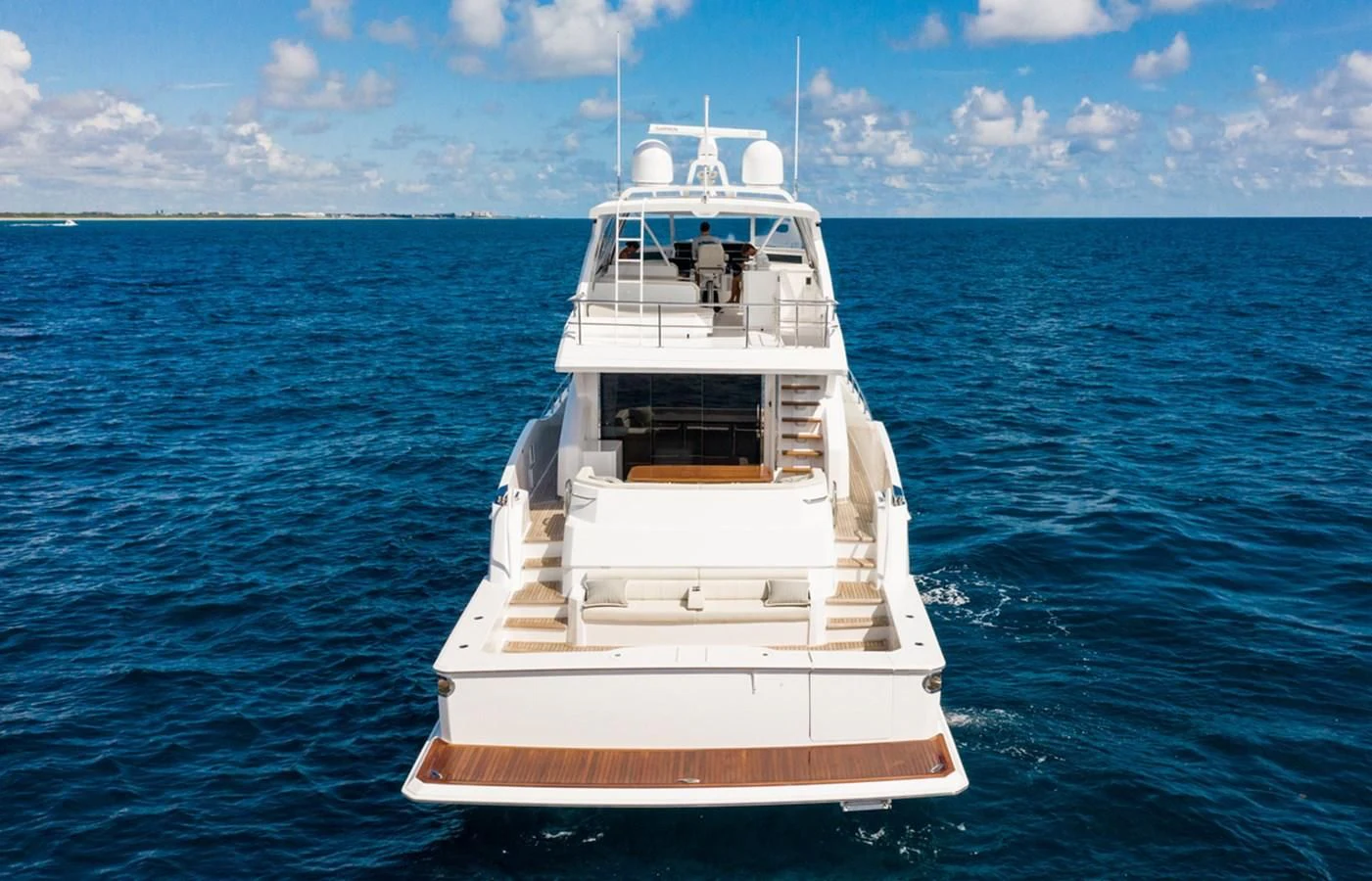 a boat in the water aboard NEW VIKING 82 COCKPIT MOTOR YACHT Yacht for Sale