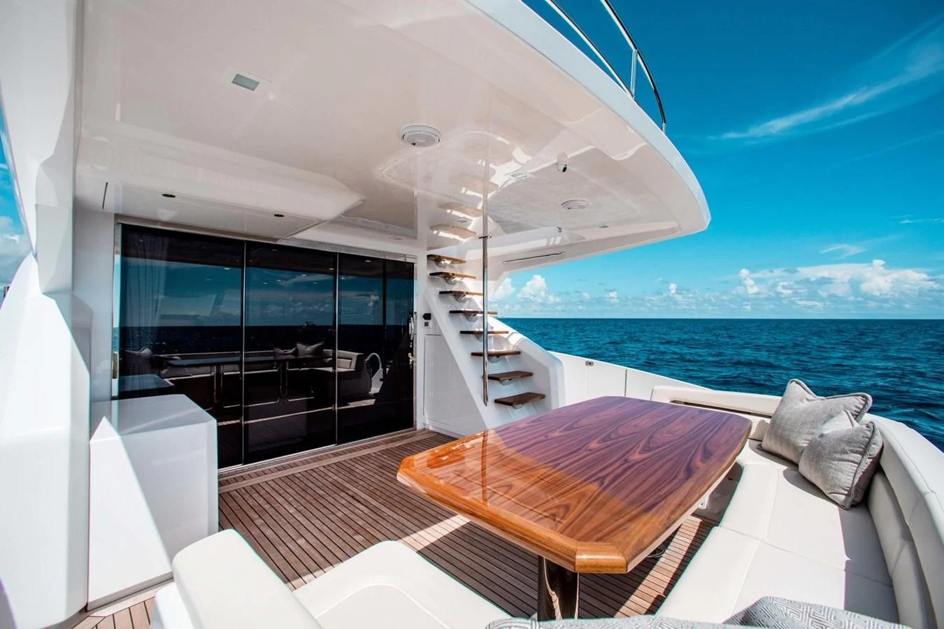 a balcony with a view of the ocean and the ocean aboard NEW VIKING 82 COCKPIT MOTOR YACHT Yacht for Sale