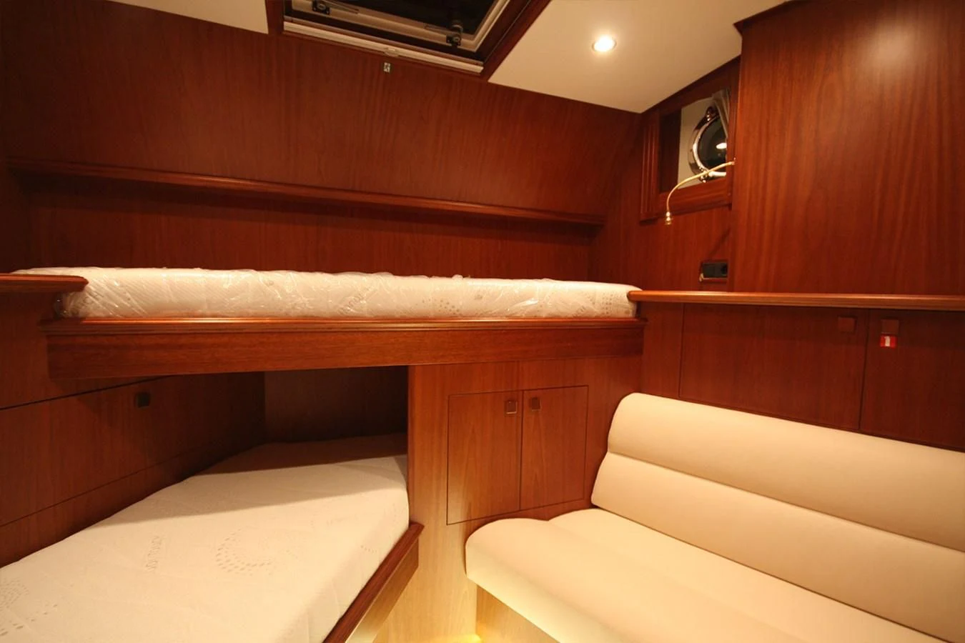 a room with a bed and a couch aboard ORION Yacht for Sale