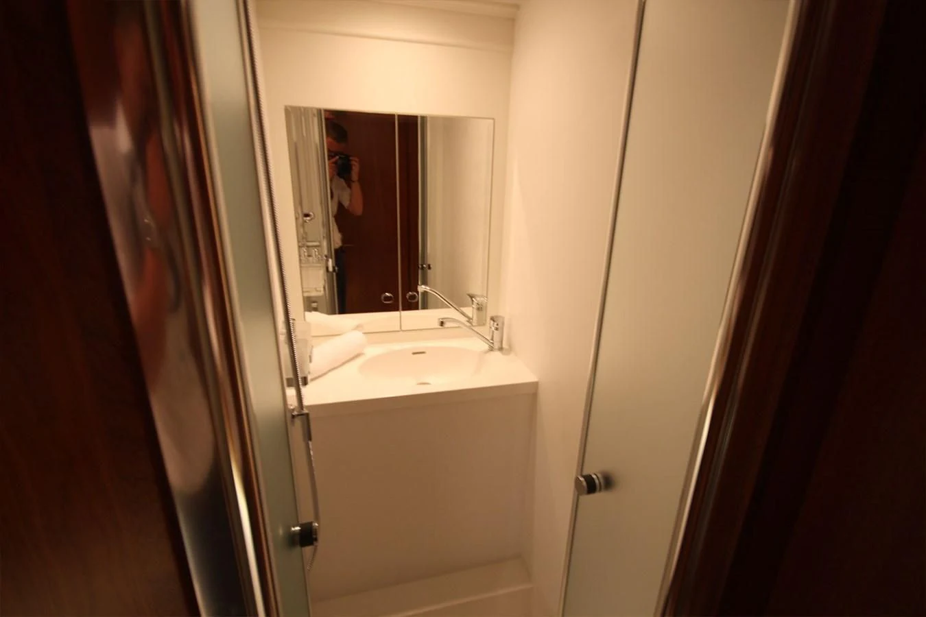 a bathroom with a sink and a mirror aboard ORION Yacht for Sale