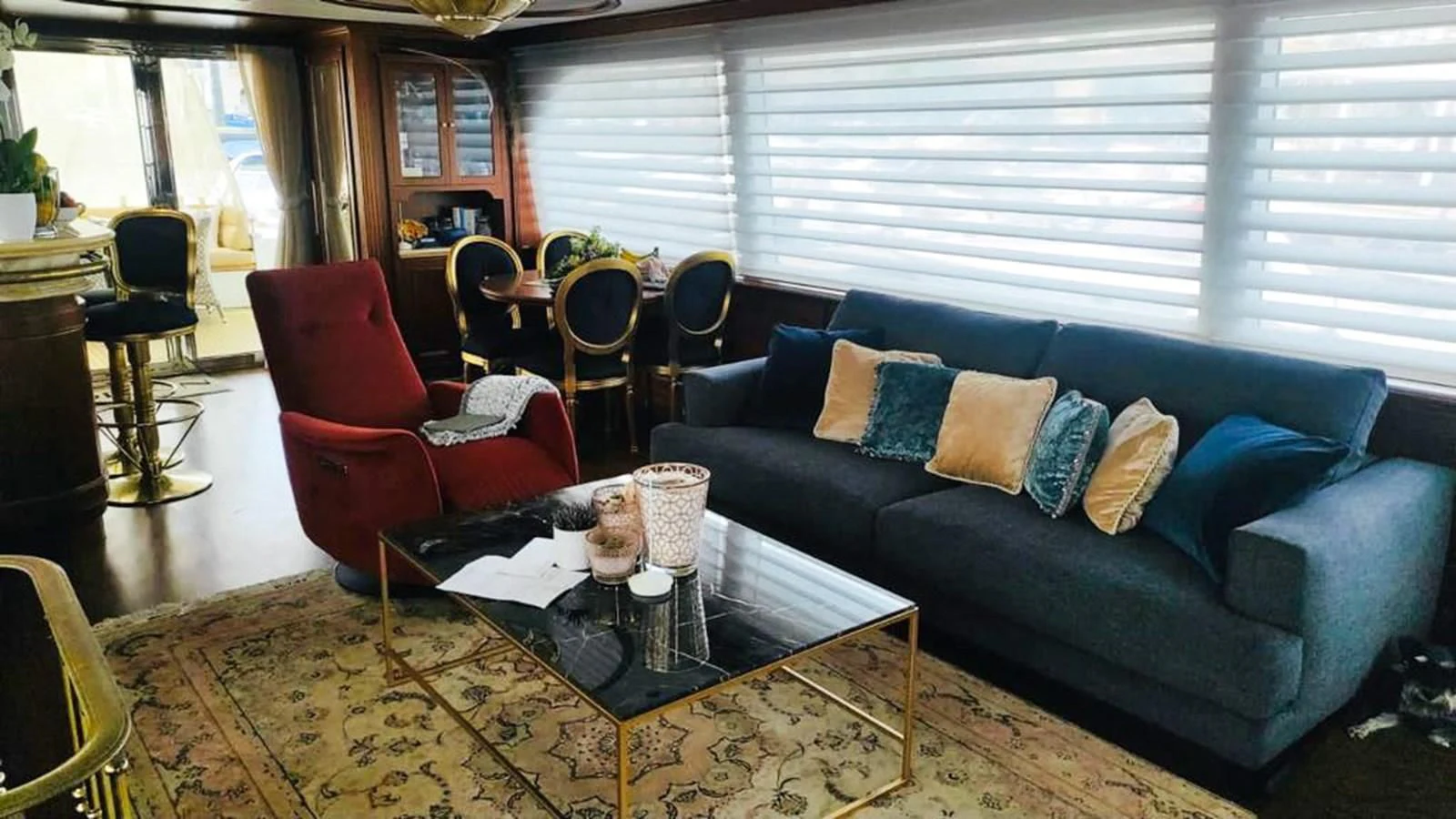 a living room with a couch and a coffee table aboard ORION Yacht for Sale