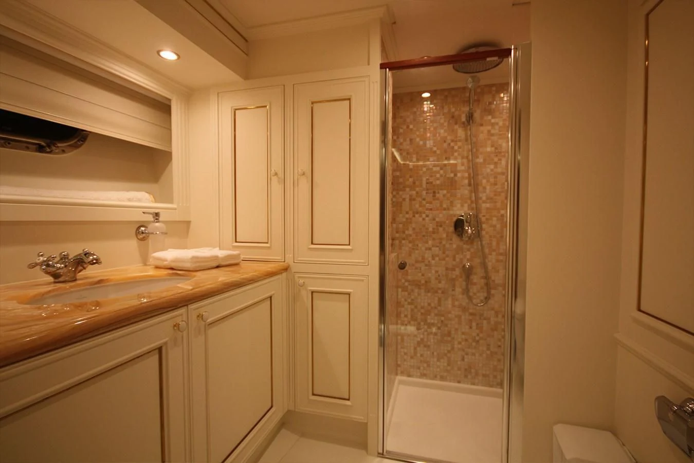 a bathroom with a glass shower aboard ORION Yacht for Sale