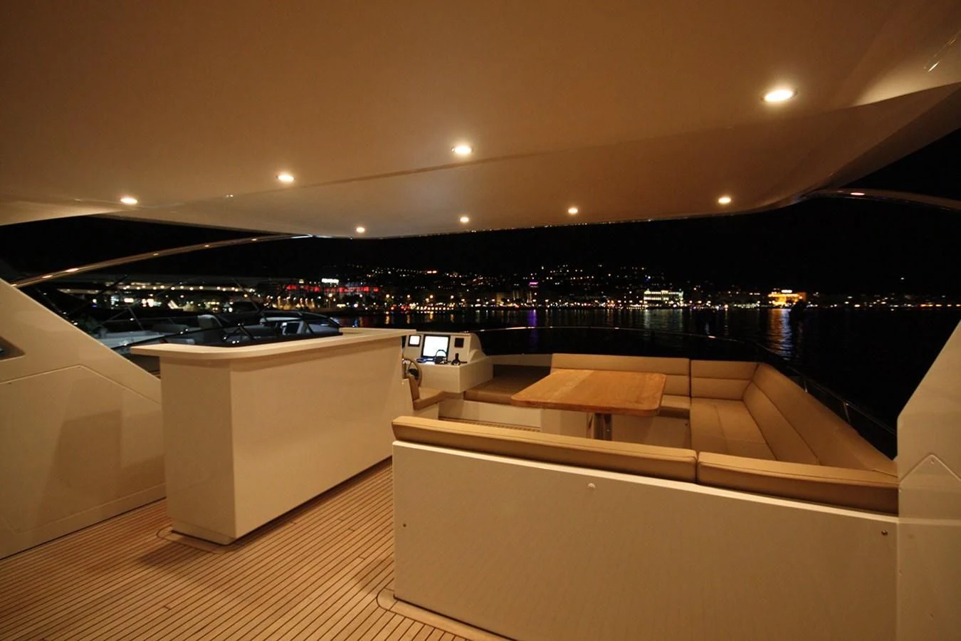 a room with a view of a city and a large body of water aboard ORION Yacht for Sale