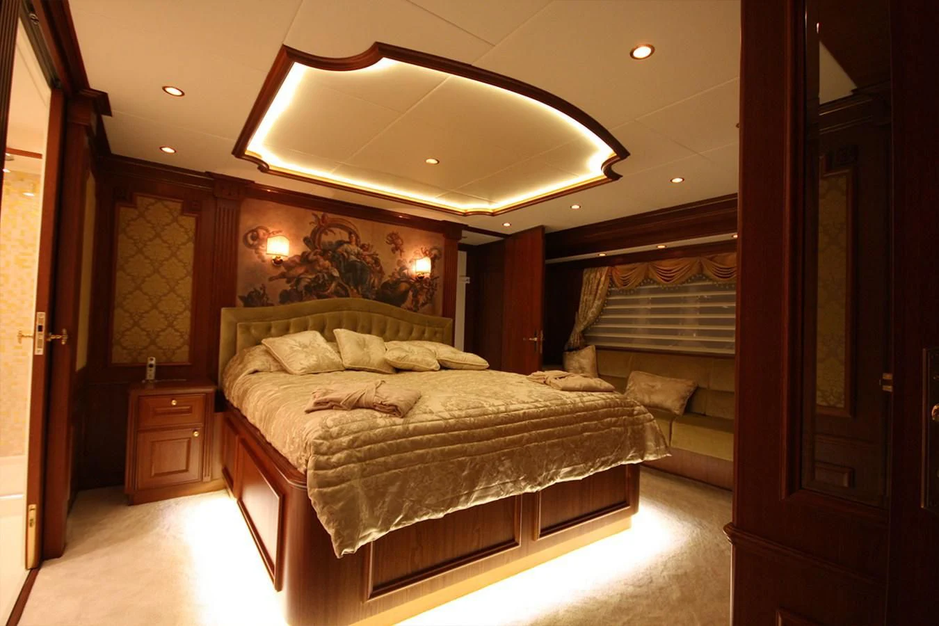 a bedroom with a large bed aboard ORION Yacht for Sale