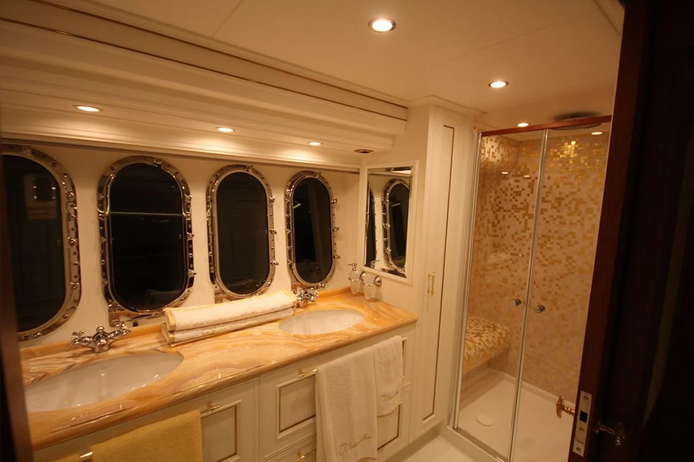 a bathroom with a large mirror aboard ORION Yacht for Sale