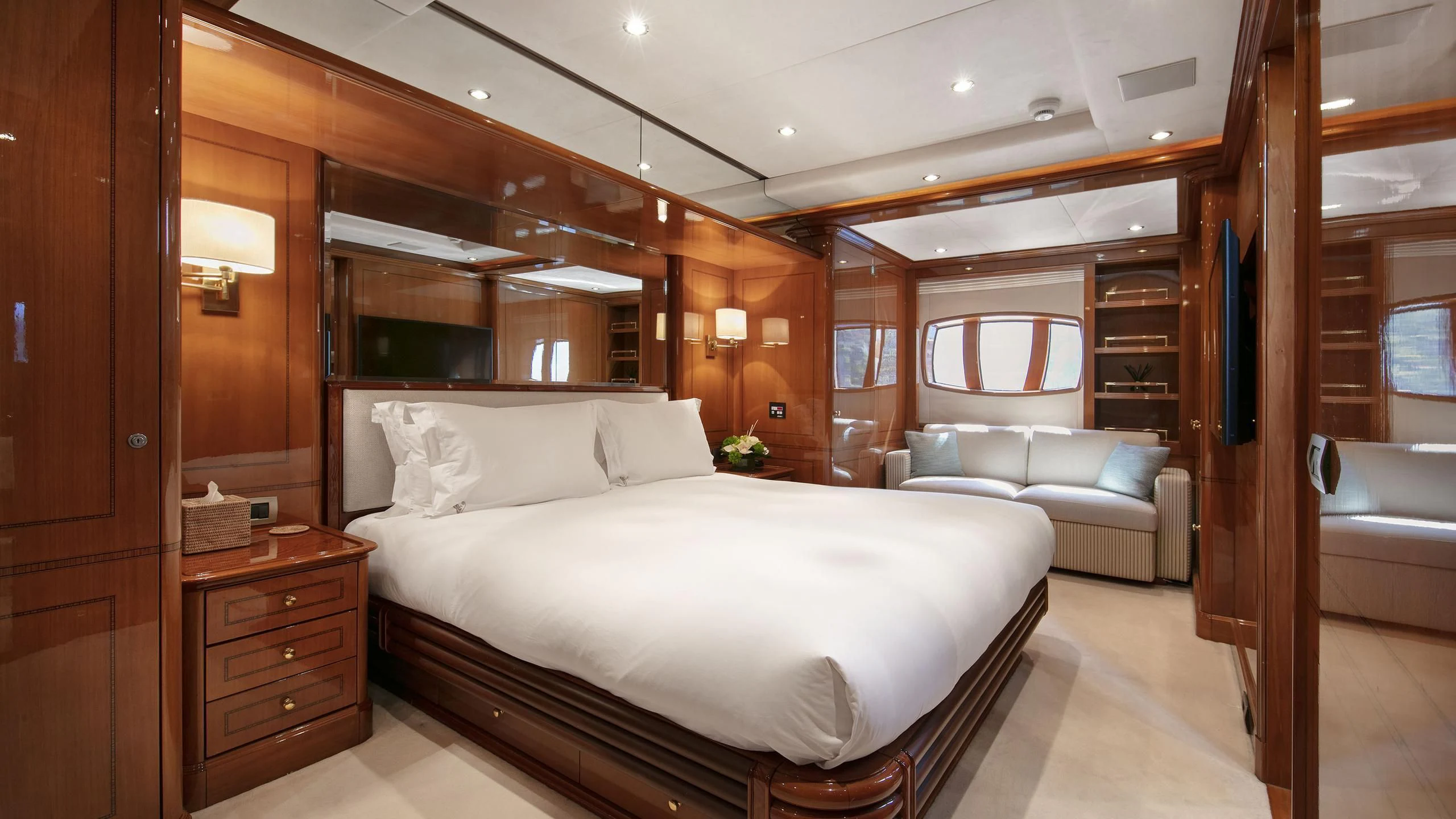 a large bed in a room aboard FARFALLINA Yacht for Sale