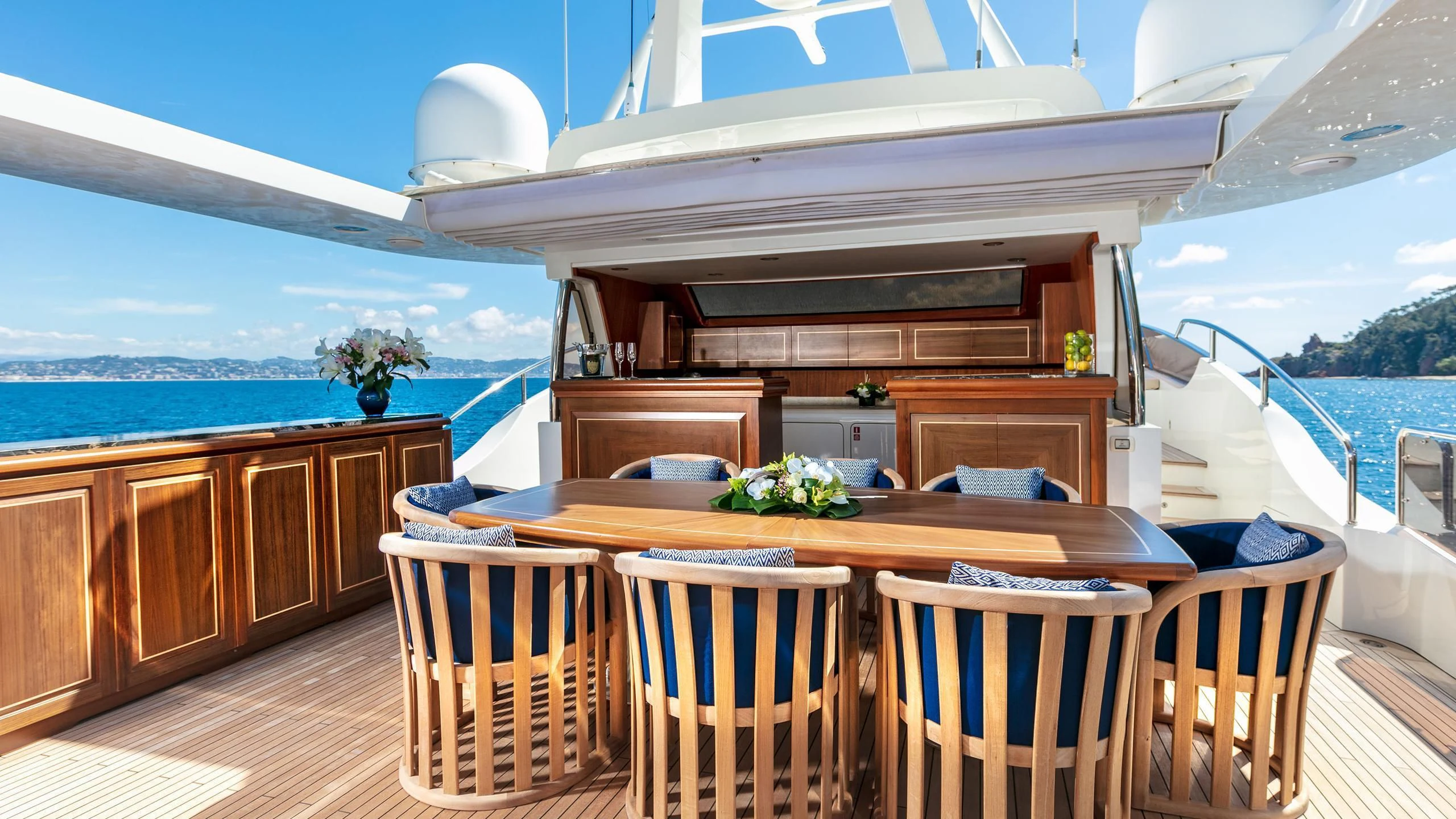 a room with a table and chairs aboard FARFALLINA Yacht for Sale