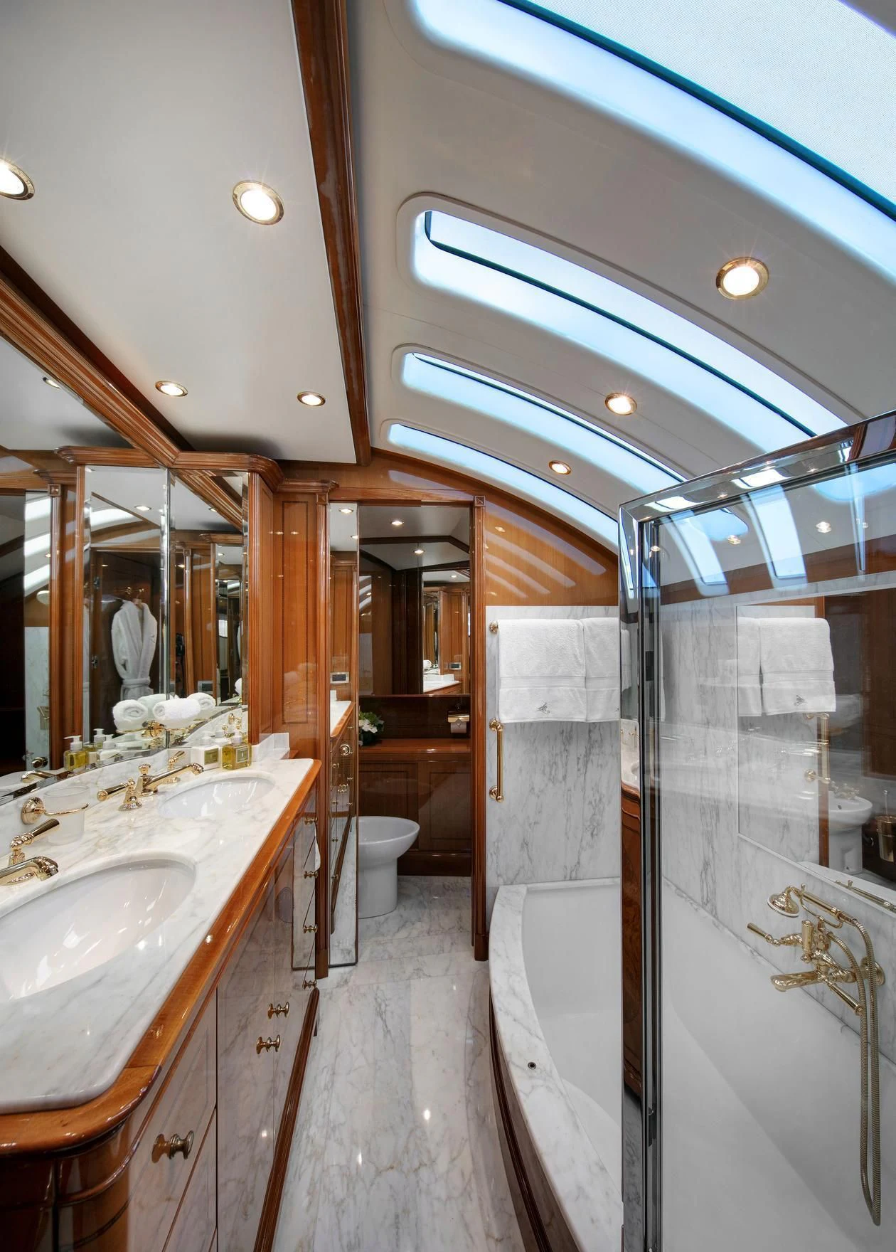a bathroom with a sink and a mirror aboard FARFALLINA Yacht for Sale