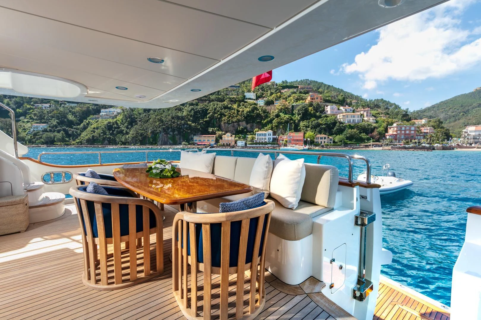 a table and chairs on a boat aboard FARFALLINA Yacht for Sale