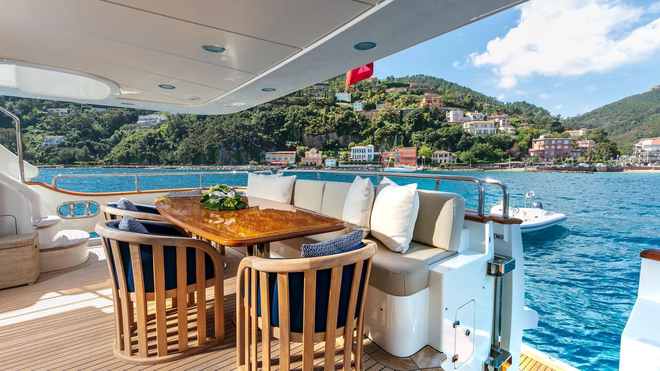 a table and chairs on a boat aboard FARFALLINA Yacht for Sale