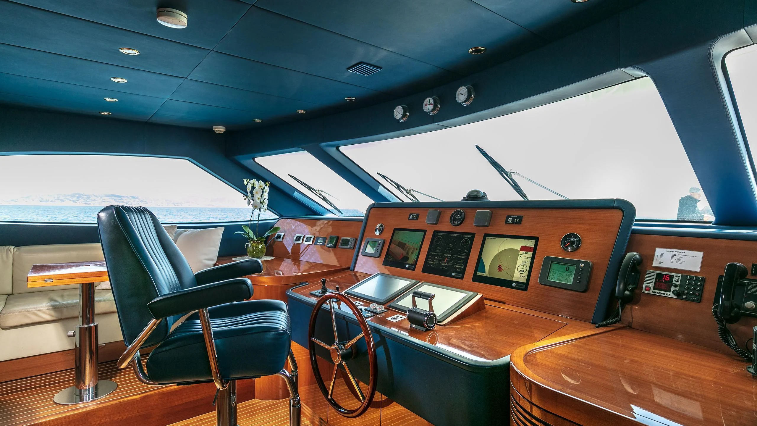 a room with a table and chairs aboard FARFALLINA Yacht for Sale