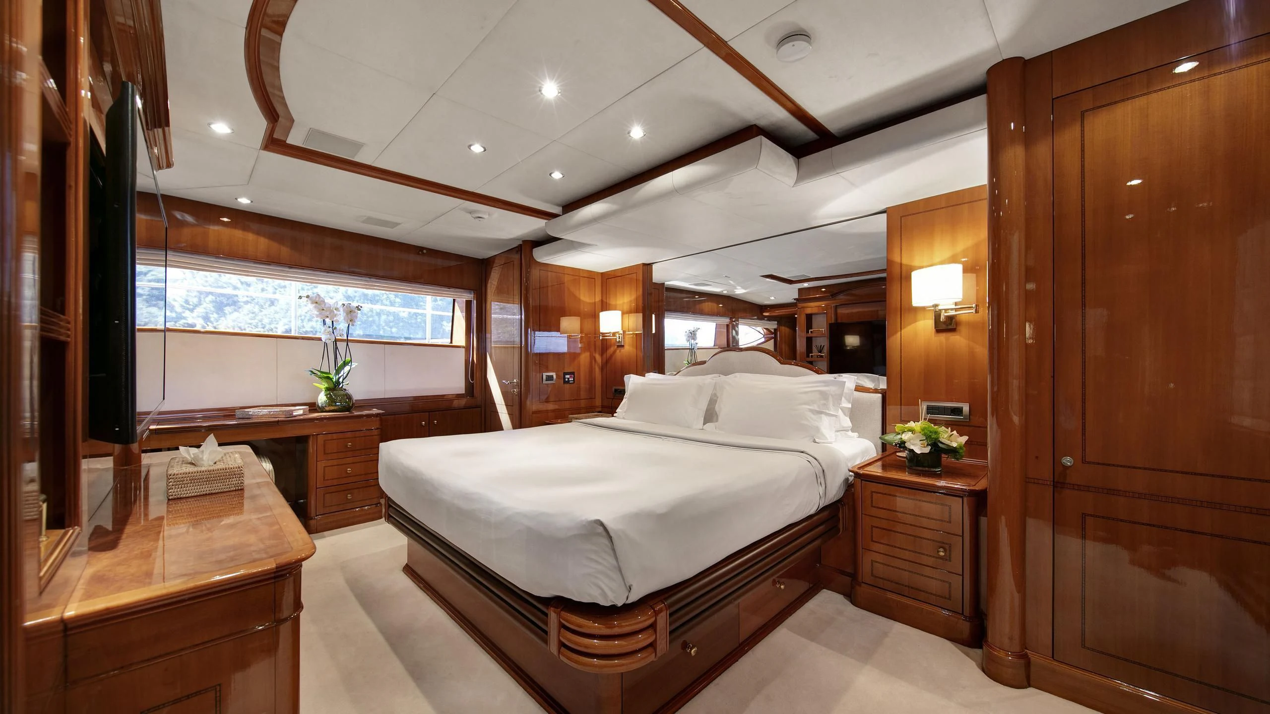a room with a bed and a desk aboard FARFALLINA Yacht for Sale