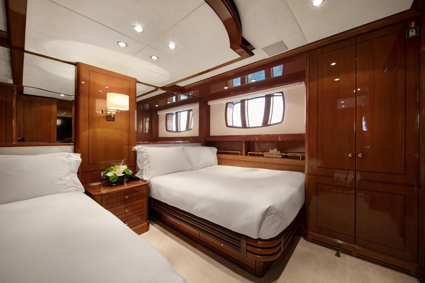 a room with a bed and a closet aboard FARFALLINA Yacht for Sale
