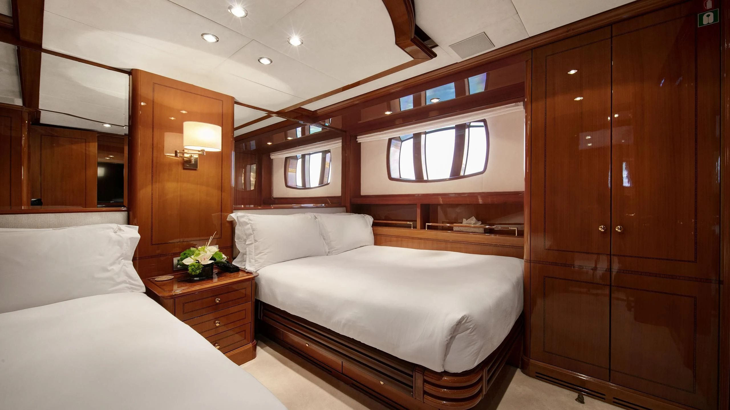 a room with a bed and a closet aboard FARFALLINA Yacht for Sale