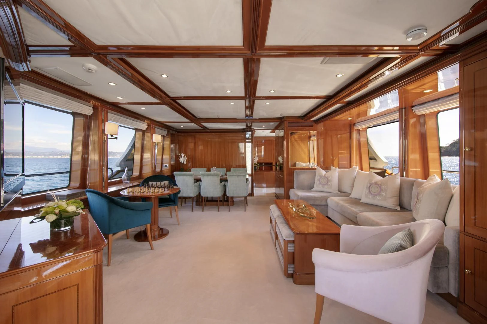 a living room with a large window aboard FARFALLINA Yacht for Sale