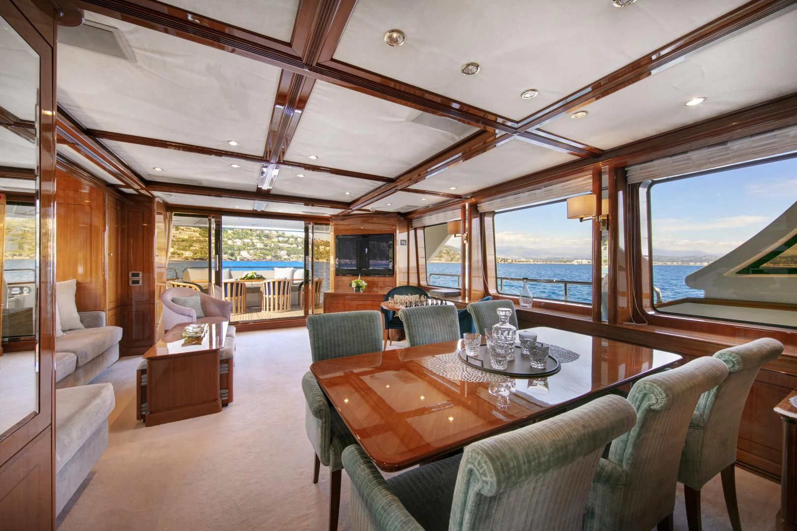a large living room with a large window aboard FARFALLINA Yacht for Sale
