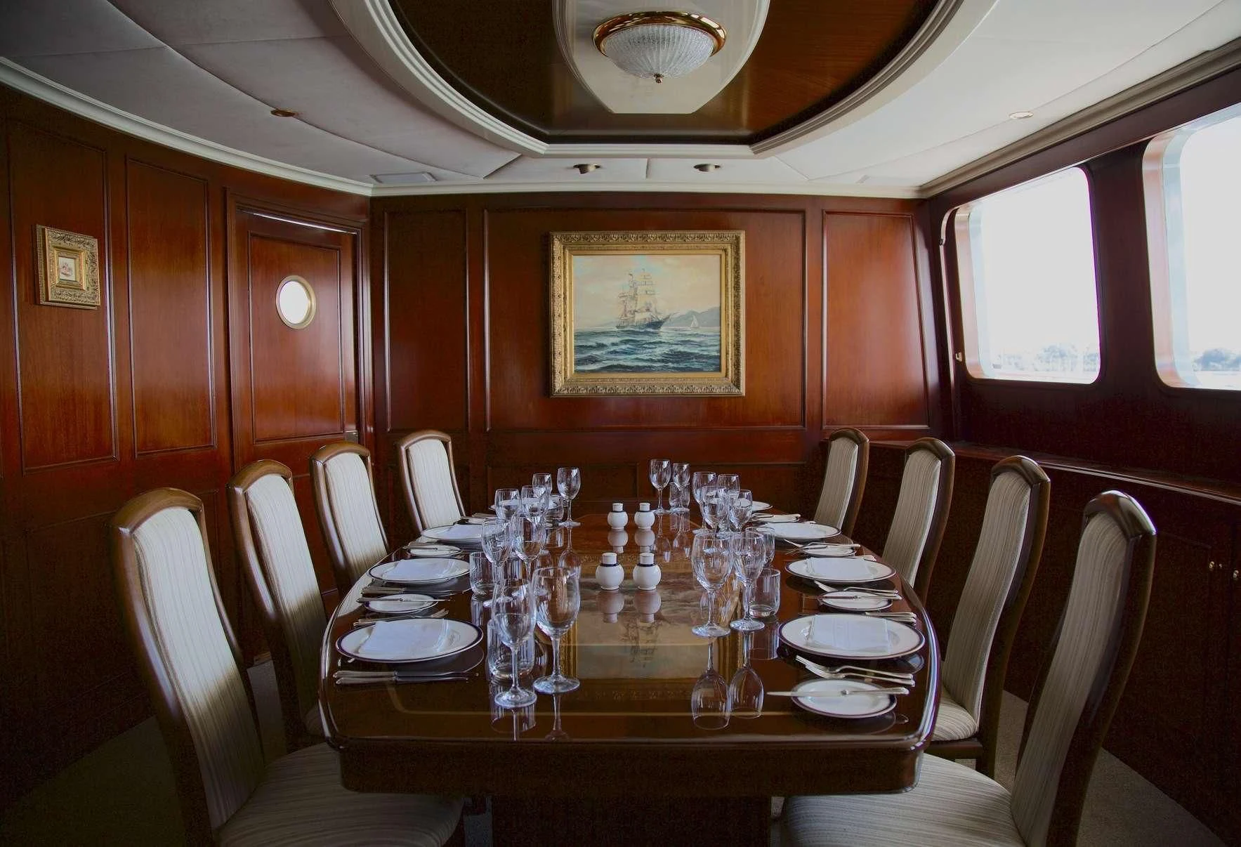 a dining table in a train aboard PACIFIC MERMAID Yacht for Sale