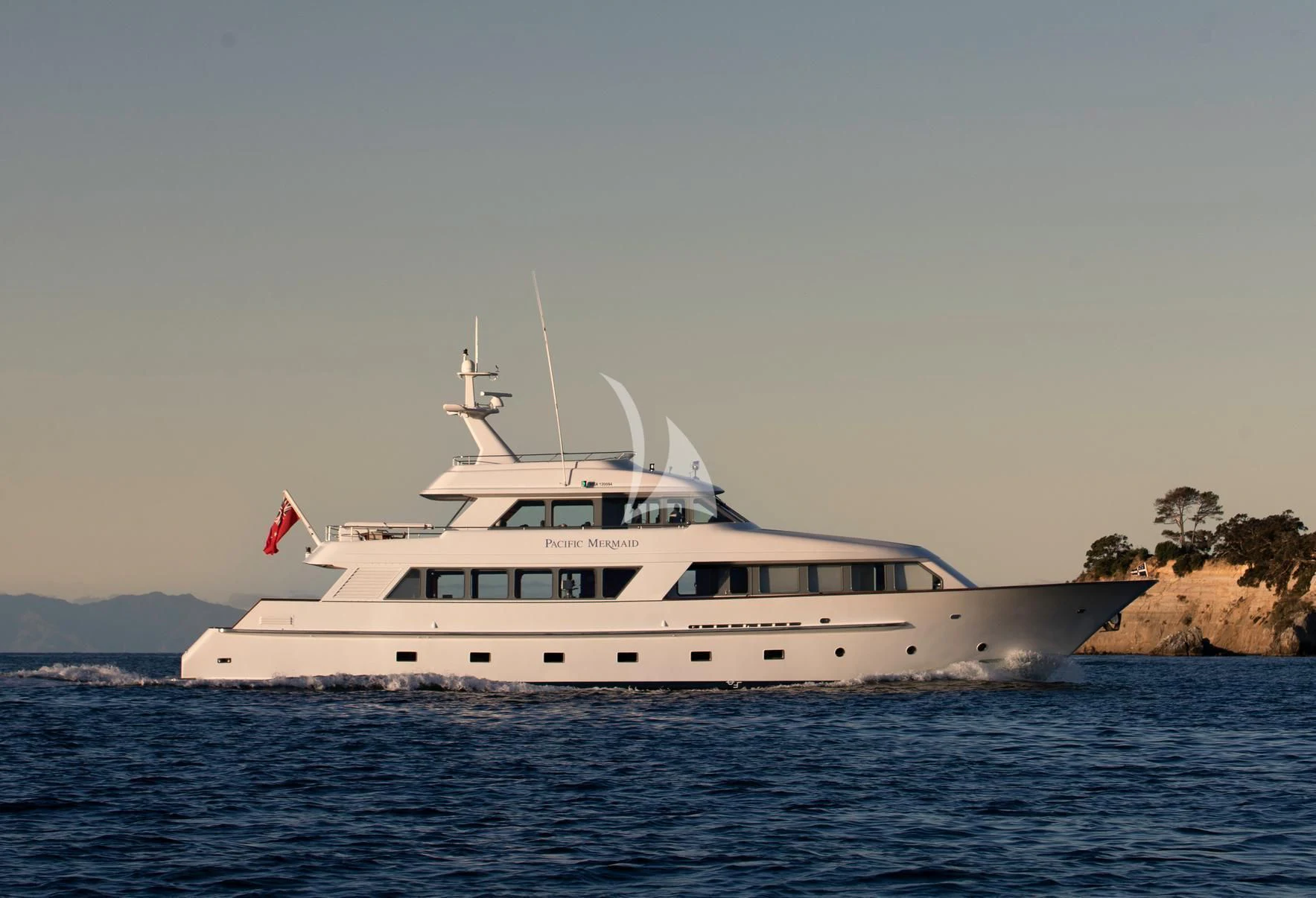 a white yacht in the water aboard PACIFIC MERMAID Yacht for Sale