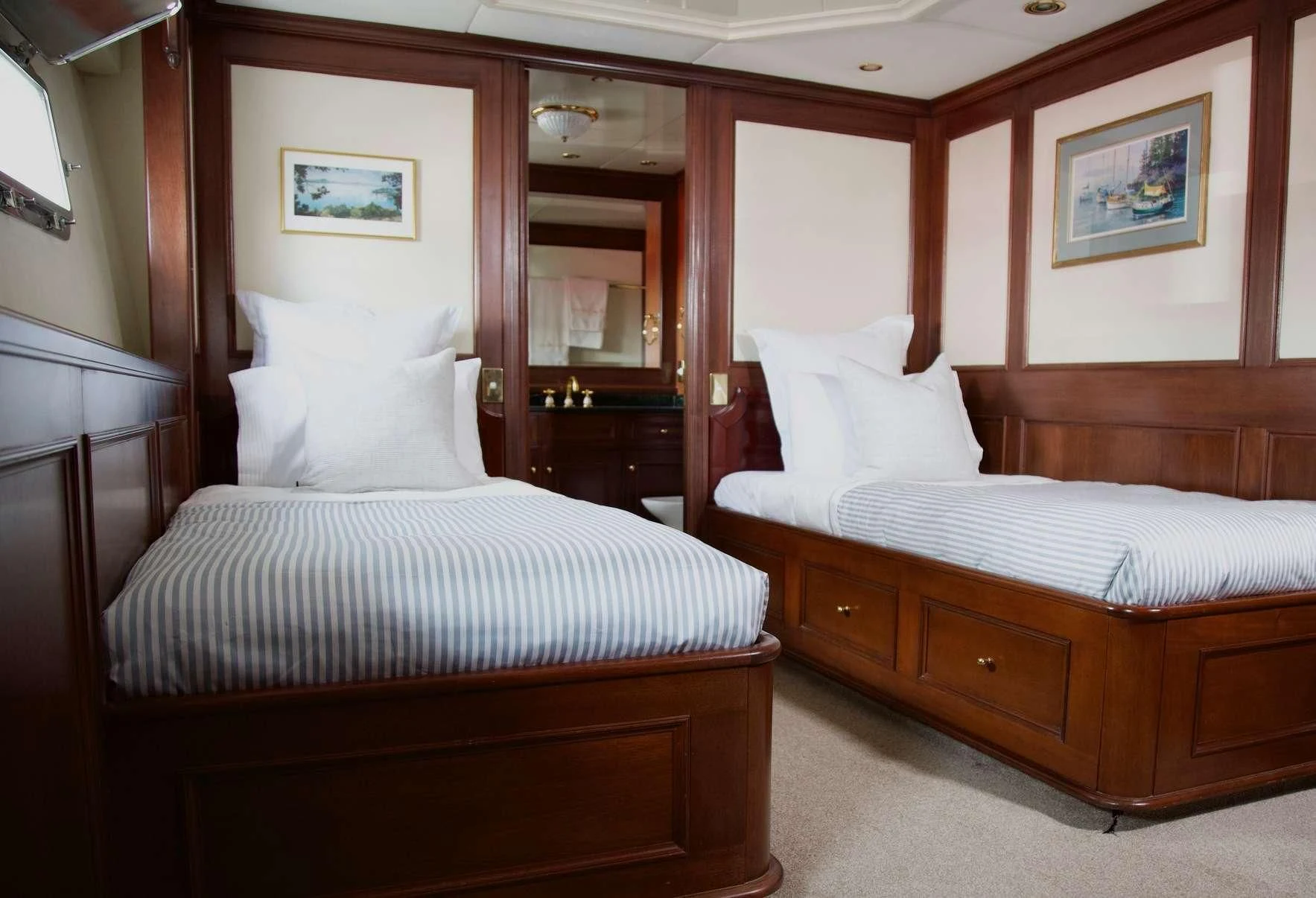 a couple of beds in a hotel room aboard PACIFIC MERMAID Yacht for Sale