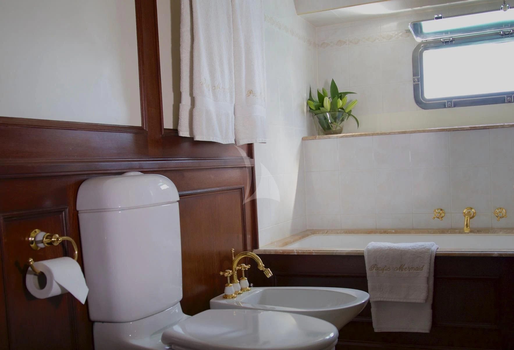 a bathroom with a toilet sink and a bathtub aboard PACIFIC MERMAID Yacht for Sale