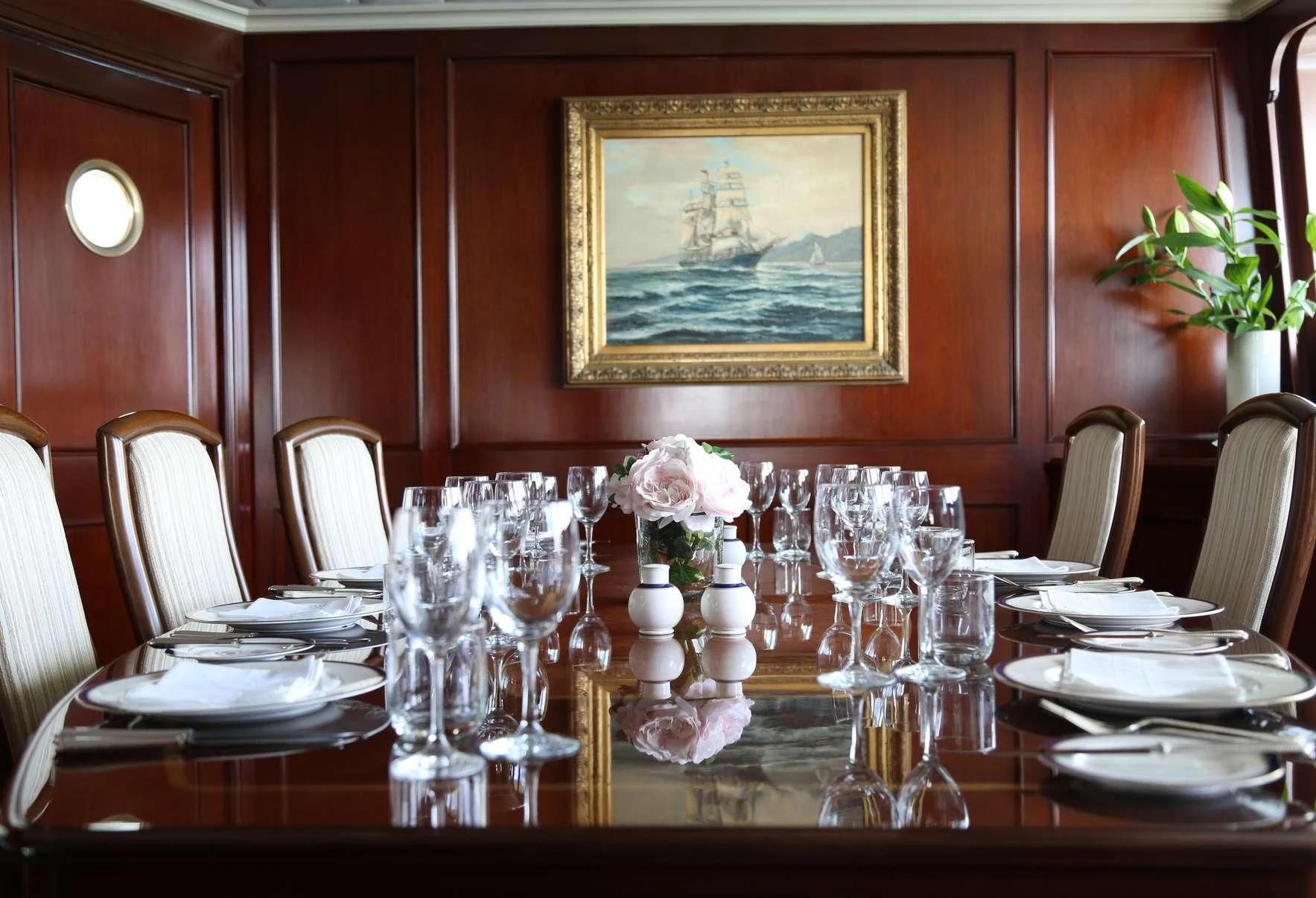 a table set for a dinner aboard PACIFIC MERMAID Yacht for Sale