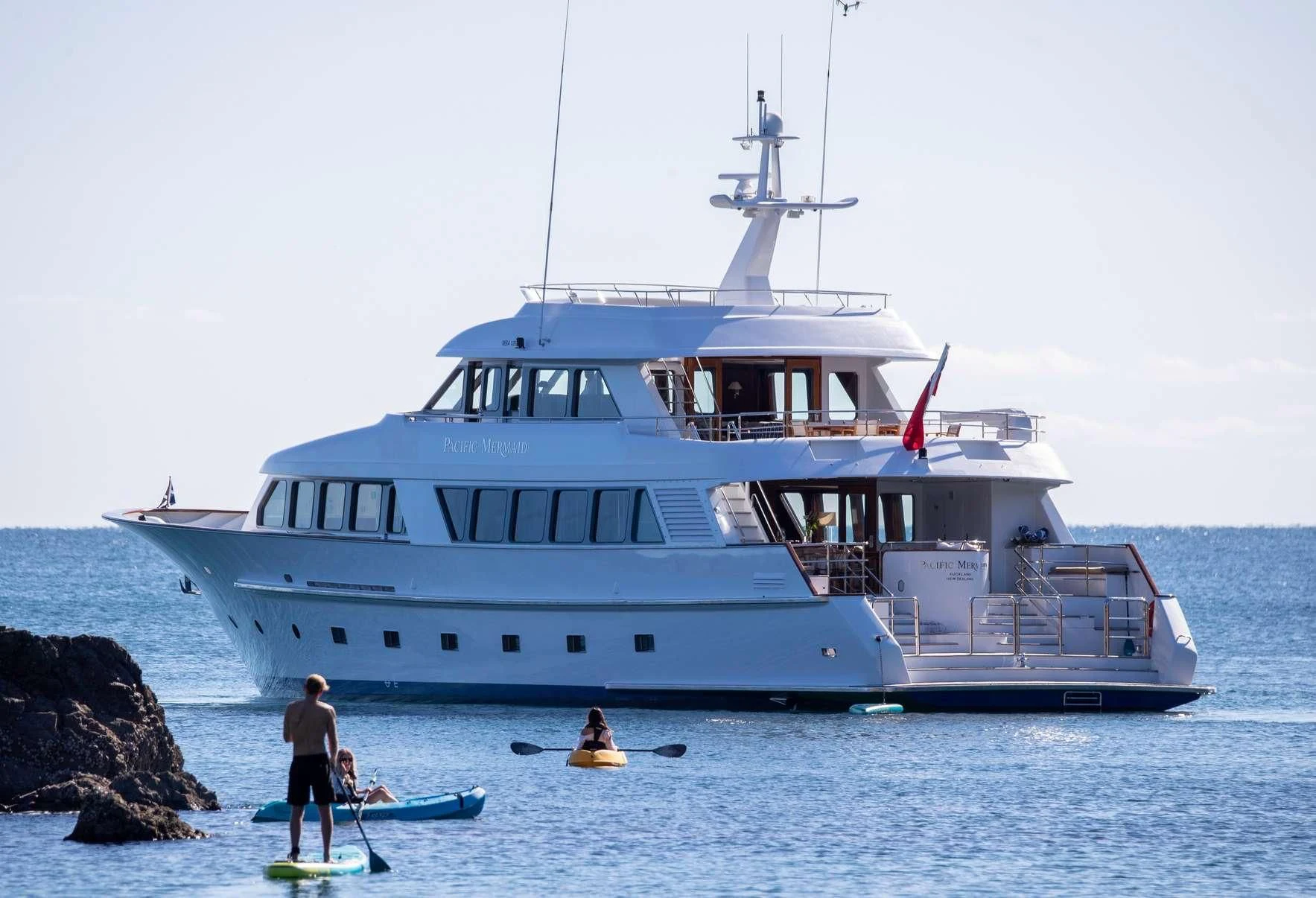 a large white boat in the water aboard PACIFIC MERMAID Yacht for Sale