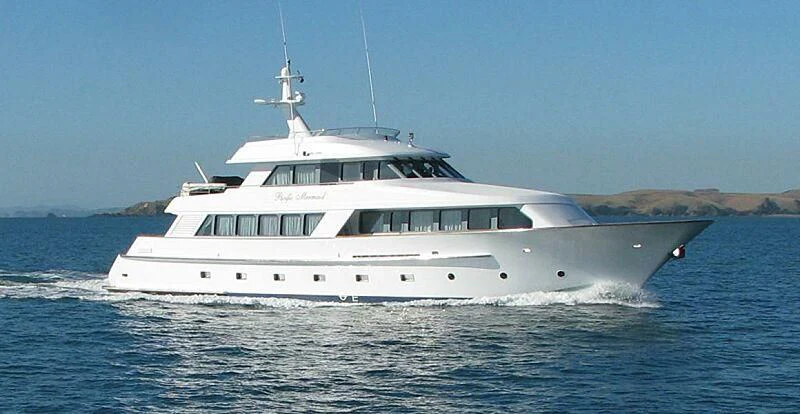 a white yacht on the water aboard PACIFIC MERMAID Yacht for Sale