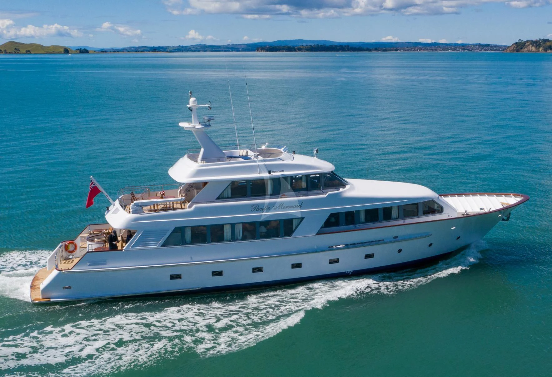 a white yacht in the water aboard PACIFIC MERMAID Yacht for Sale