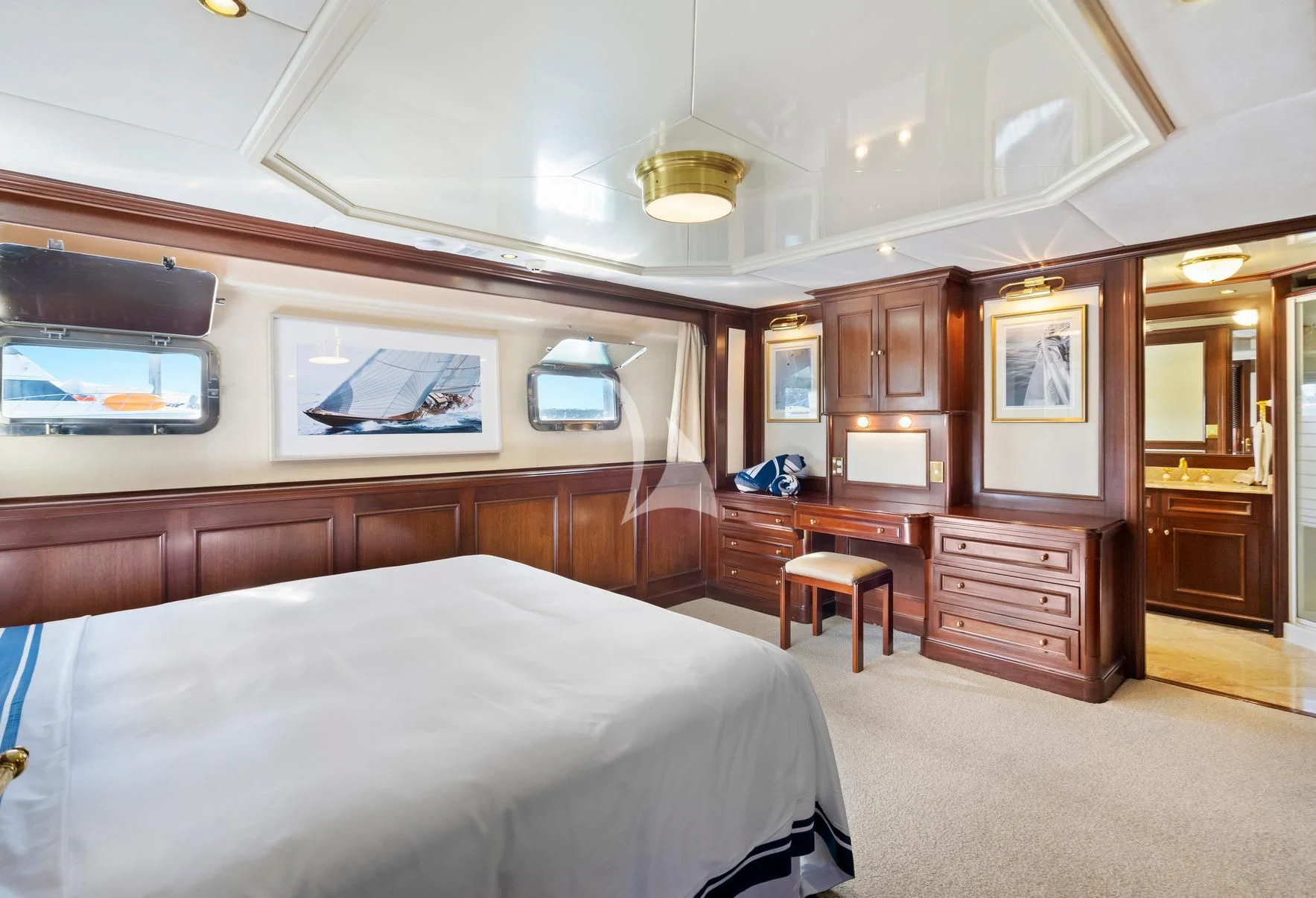 a bedroom with a large bed aboard PACIFIC MERMAID Yacht for Sale