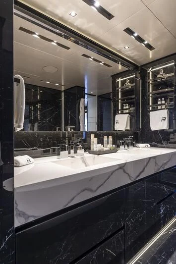 a bathroom with a large mirror aboard RUSH Yacht for Sale