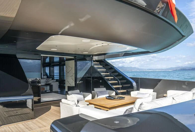 a room with a view of the ocean and a balcony aboard RUSH Yacht for Sale