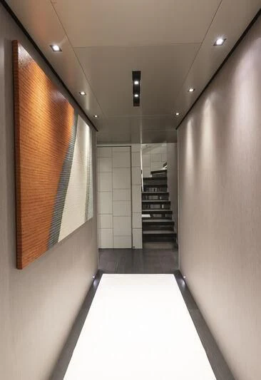 a hallway with a door and a window aboard RUSH Yacht for Sale