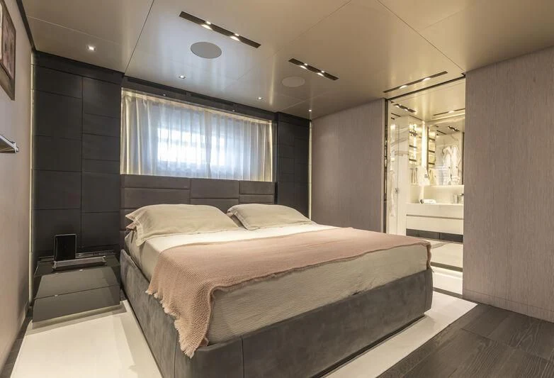 a large bedroom with a large bed aboard RUSH Yacht for Sale