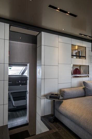 a room with a couch and a fireplace aboard RUSH Yacht for Sale