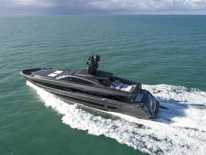 a military ship in the ocean aboard RUSH Yacht for Sale