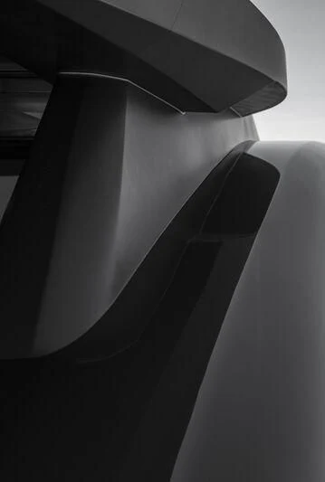 a black and white photo of a black chair aboard RUSH Yacht for Sale