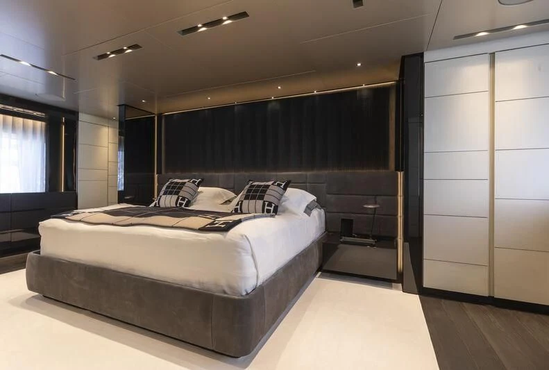 a large bedroom with a large bed aboard RUSH Yacht for Sale