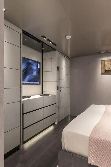 a bedroom with a large mirror aboard RUSH Yacht for Sale