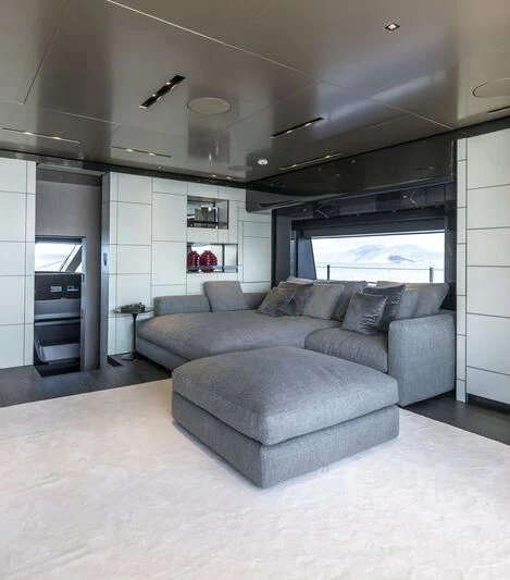 a large living room with a large window aboard RUSH Yacht for Sale