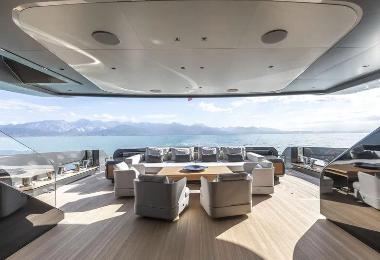 a room with a table and chairs aboard RUSH Yacht for Sale